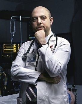 Sam Parnia in Attending Physician lab coat with stethoscope